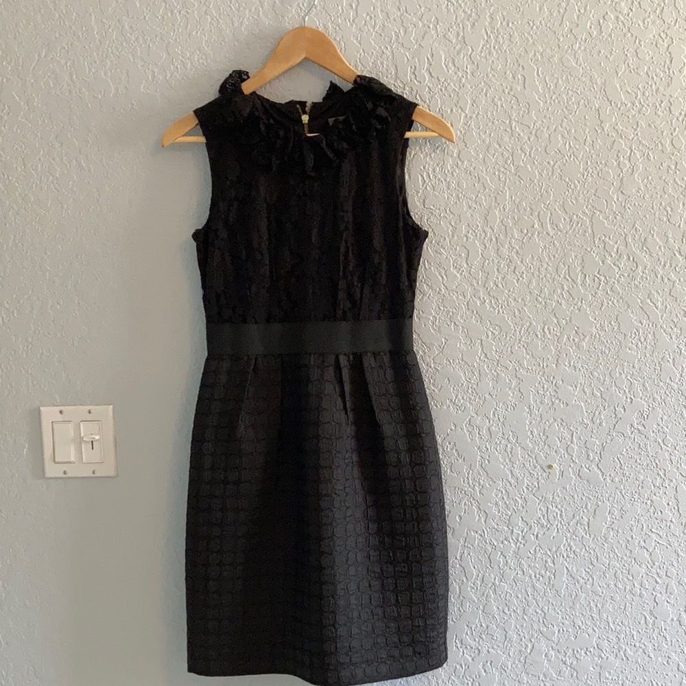 Black sleeveless dress with lace and texture